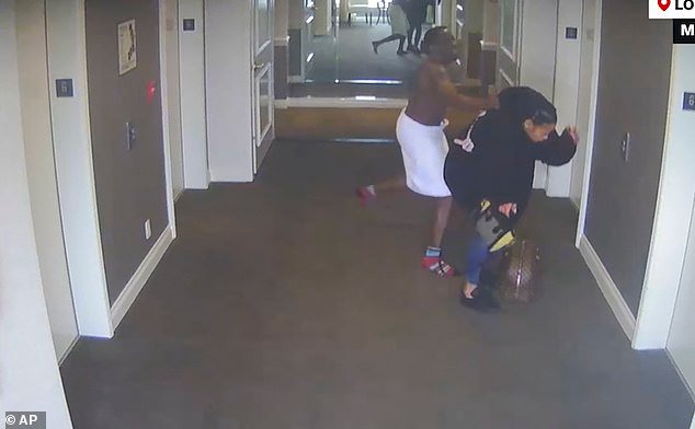98389331-14717929-Footage_of_the_rap_mogul_assaulting_his_then_girlfriend_Cassie_i-a-87_174735126017.jpeg