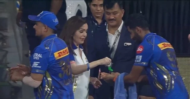 Covid-19-in-Mumbai-Indians-camp-MI-owner-Nita-Ambani-sanitizes-hands-of-Jasprit-Bumrah-and-other-pla.webp