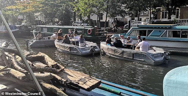 99002025-14776787-Pictured_Groups_of_people_using_the_rental_GoBoats_in_the_west_L-a-5_1748970146276.jpeg