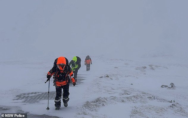 99196375-14795805-Alpine_officers_from_the_NSW_Police_Force_and_SES_hiked_on_foot_-m-13_174950776316.jpeg