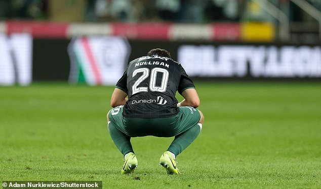 101647833-15045115-Josh_Mulligan_sinks_to_his_knees_in_dejection_after_late_heartbr-m-2_175642019657.jpeg