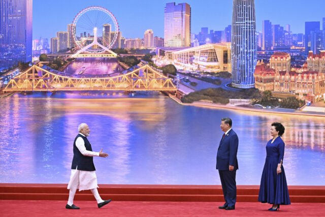 modi-greets-xi-sco-summit.jpg