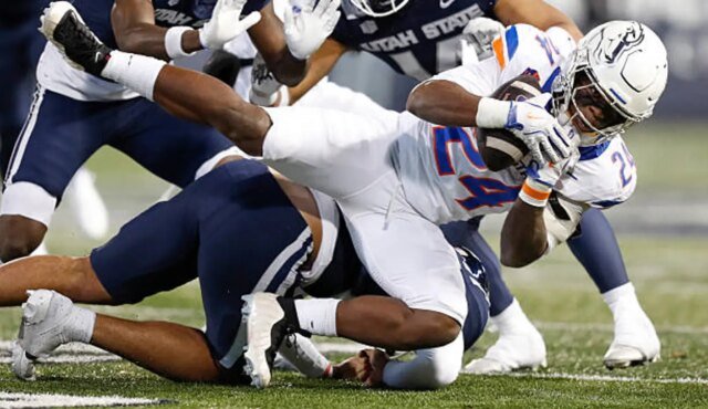 logan-ut-dylan-riley-of-the-boise-state-broncos-rushes-the-ball-against-the-utah-state-aggies.jpg